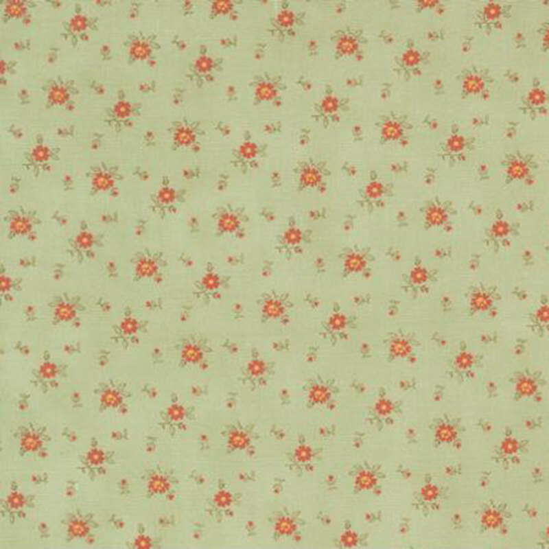 fabric pattern of roses scattered all over a green background