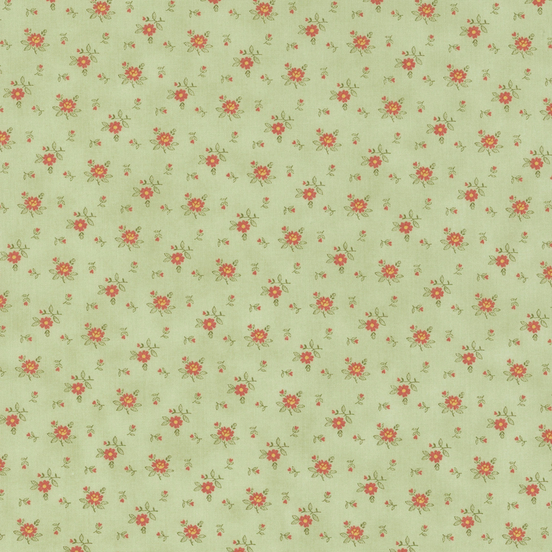 Fabric pattern of roses scattered all over a light green background.