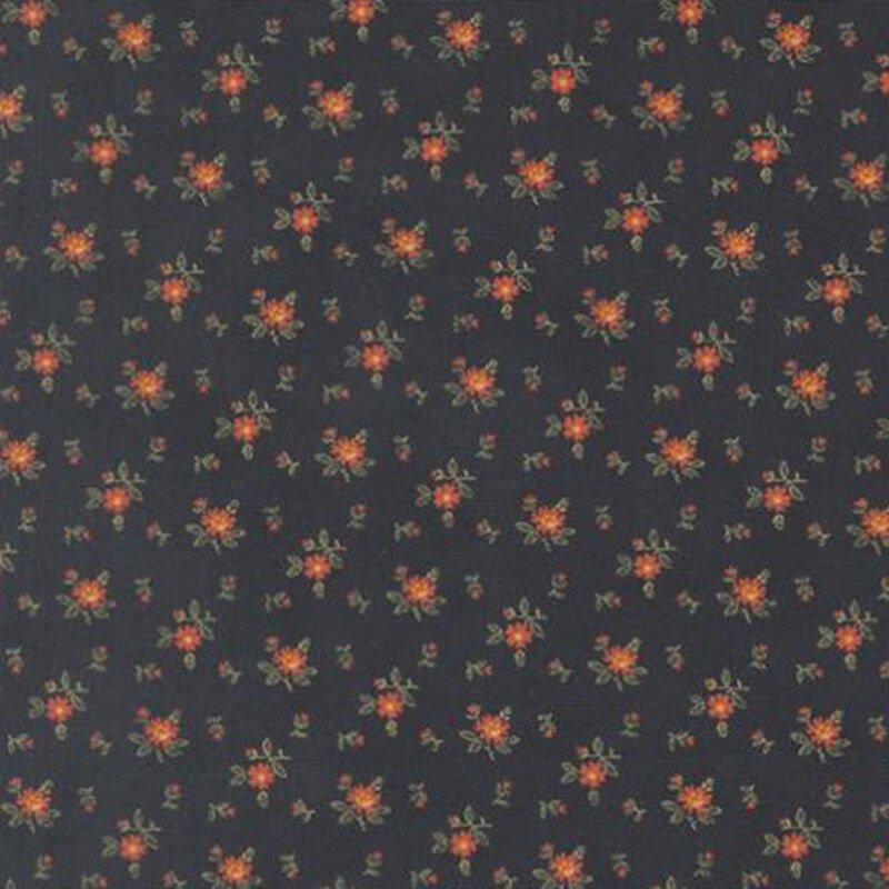 fabric pattern of roses scattered all over a dark blue background