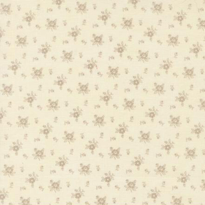 fabric pattern of roses scattered all over a cream background