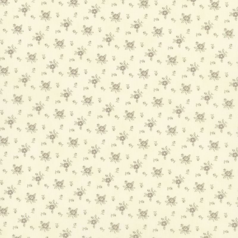 Fabric pattern of grayscale roses scattered all over a cream background.