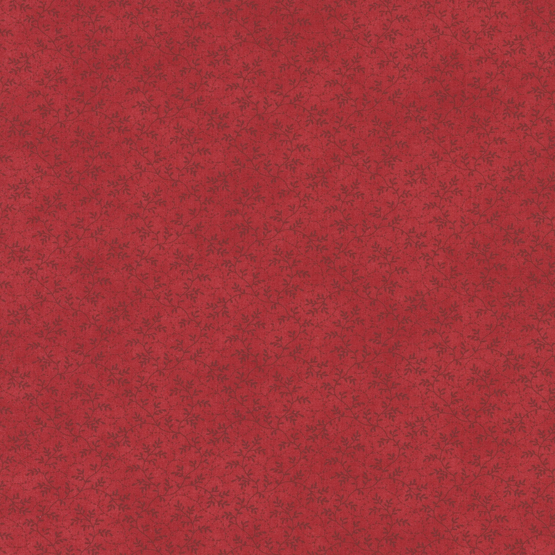 fabric pattern of thin, leafy vines scattered all over a red background.