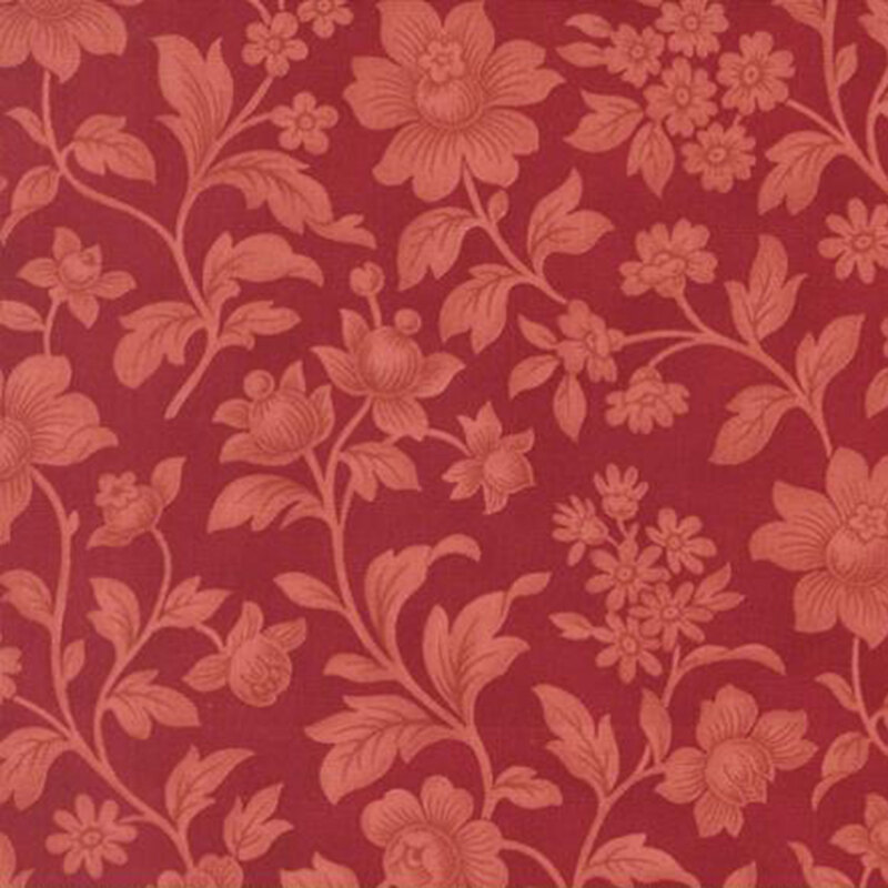 fabric pattern of florals and leaves on a red background