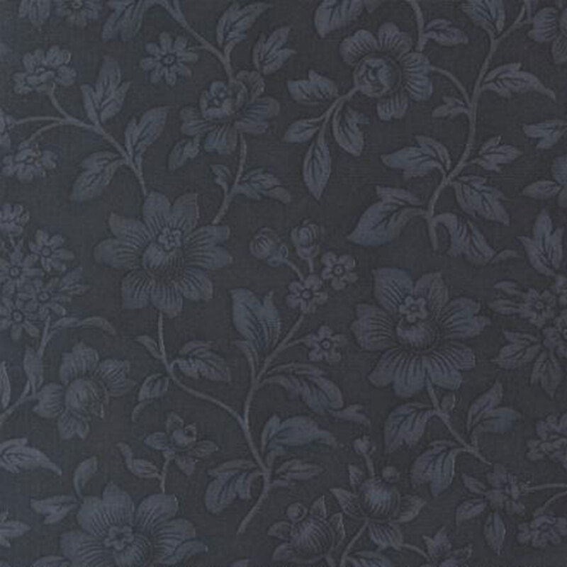 fabric pattern of florals and leaves on a navy background