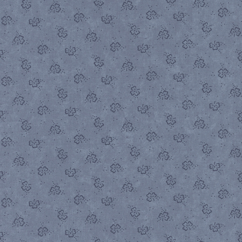 A blue fabric pattern featuring small, simple floral shapes.