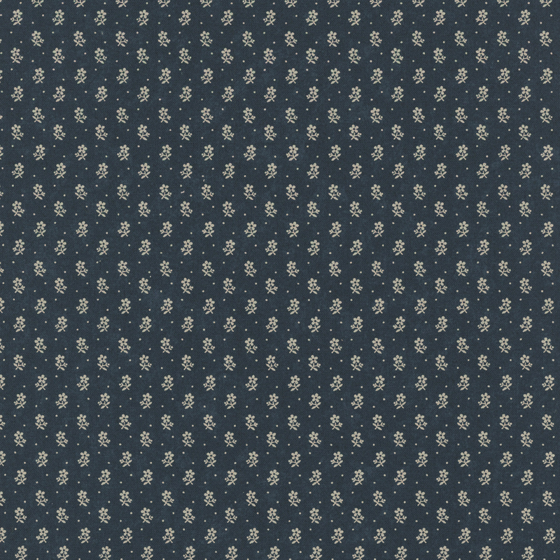 Dark blue fabric with a repeating pattern of small white and yellow flowers.