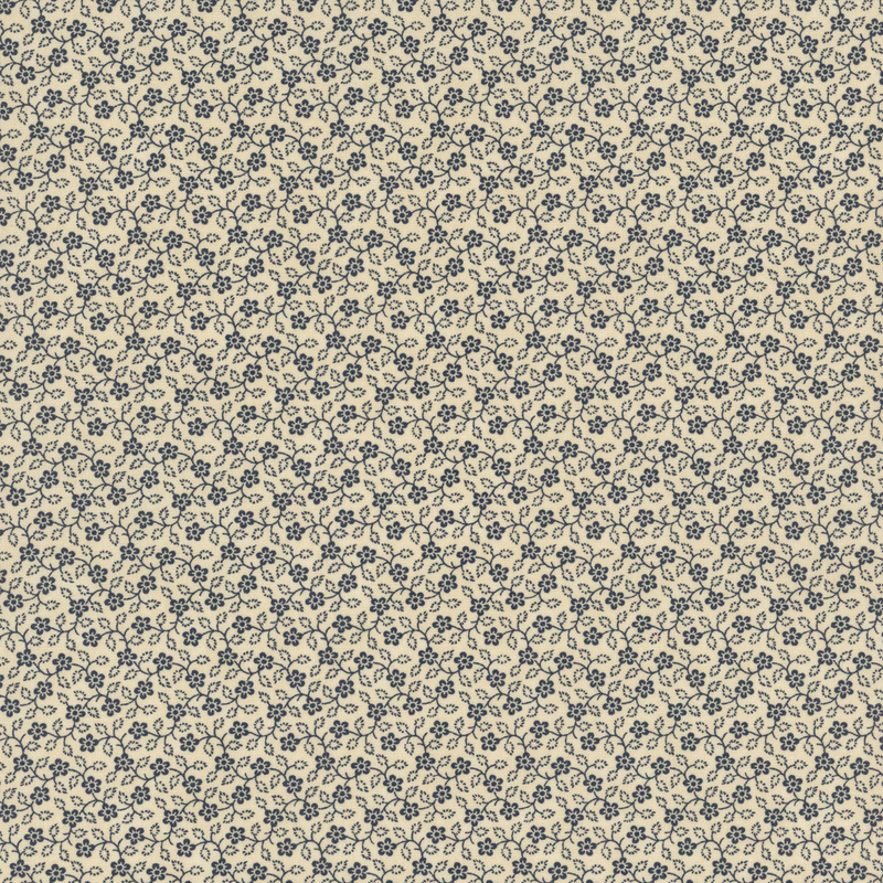 Repeating floral pattern in navy blue on a light beige fabric.