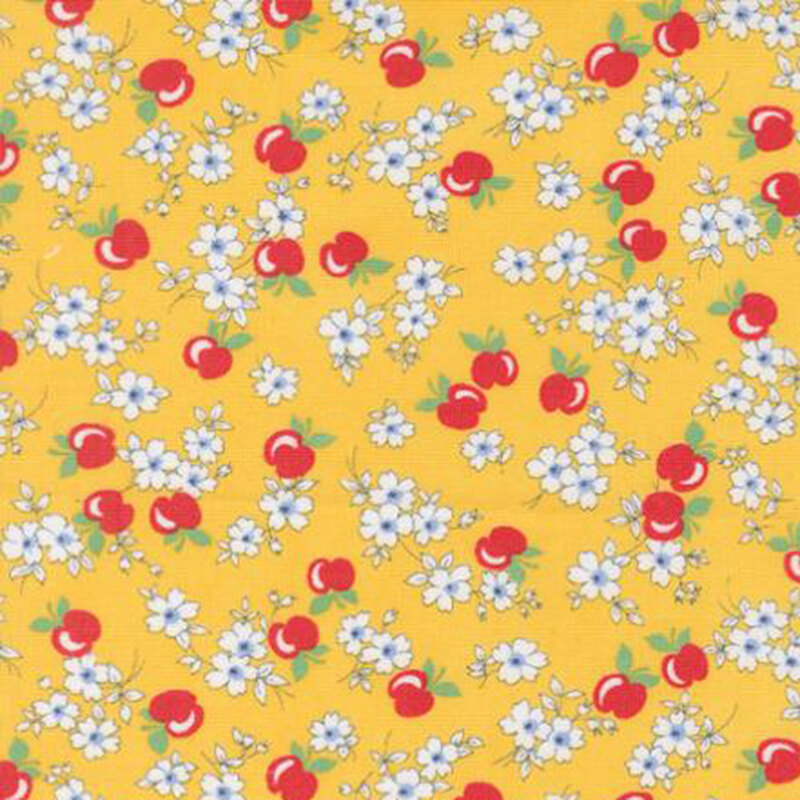 fabric pattern of apples and flowers on a yellow background