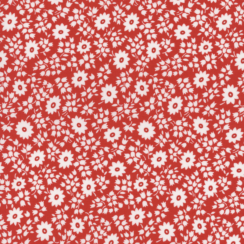 fabric pattern of white florals on a red background