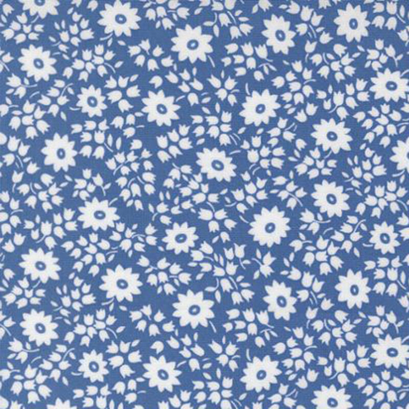 fabric pattern of white florals on a blue background