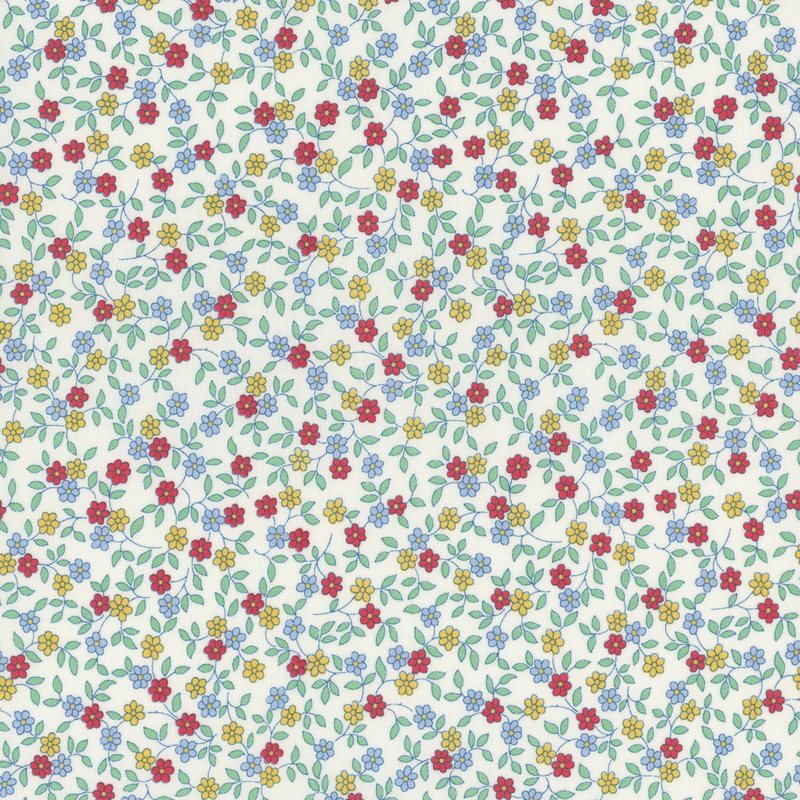 fabric pattern of  red, yellow, and blue florals scattered all over a white background