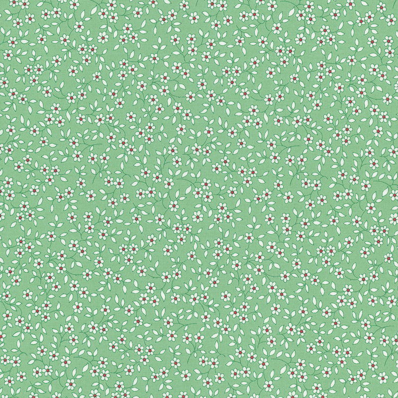 fabric pattern of white florals scattered all over a green background