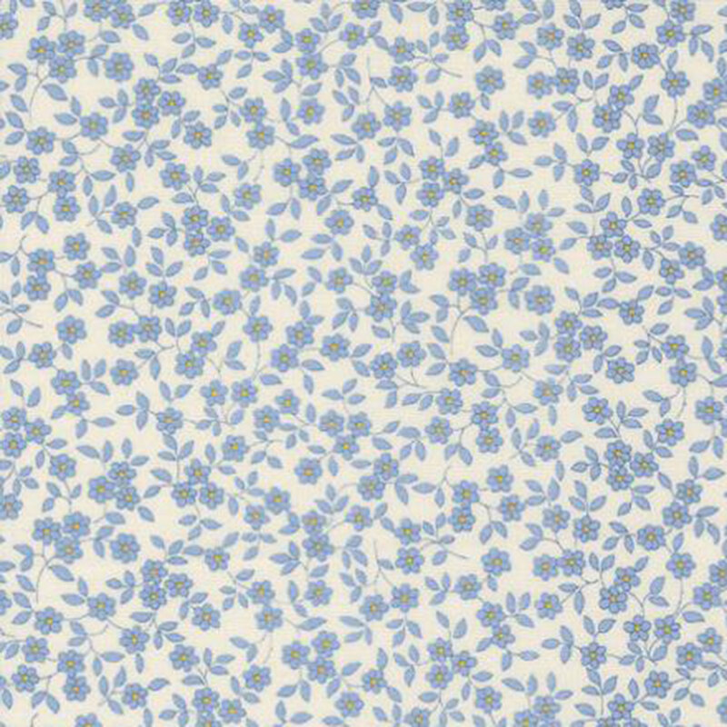 fabric pattern of blue florals scattered all over a white background