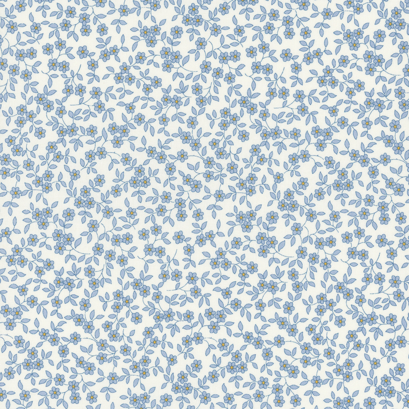 fabric pattern of blue florals scattered all over a white background