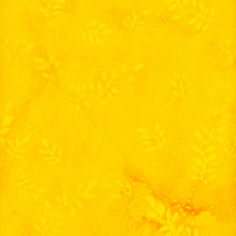 fabric pattern of tonal leaves on a yellow background