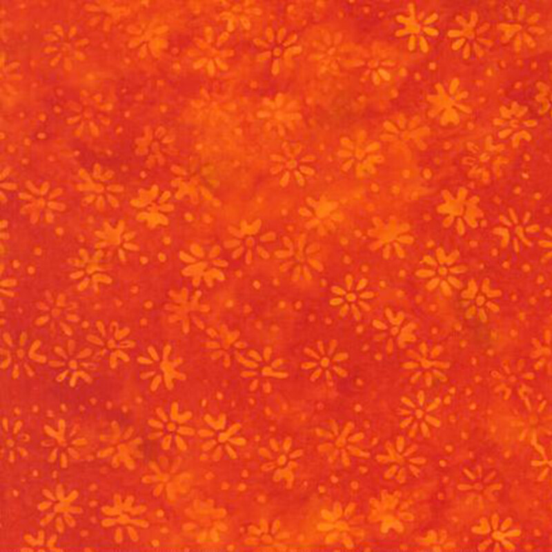 fabric pattern of flower motifs on a orange background