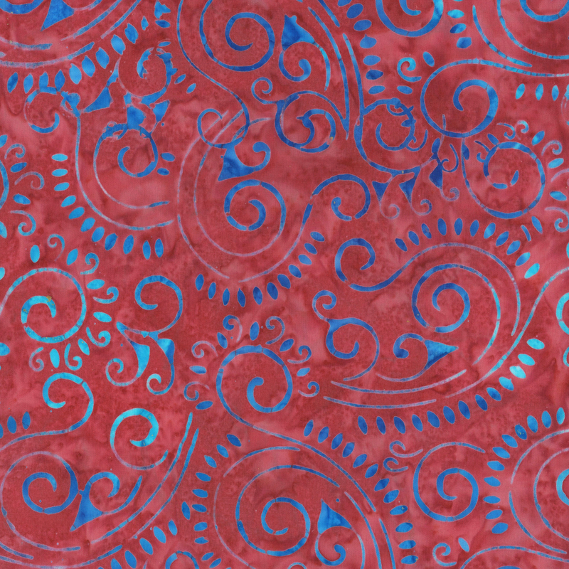 fabric pattern of blue swirls on a red background