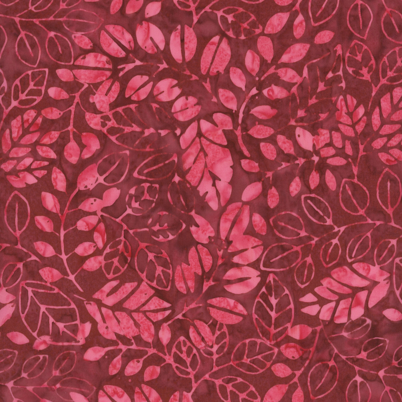 fabric pattern of leaves on a dark red background