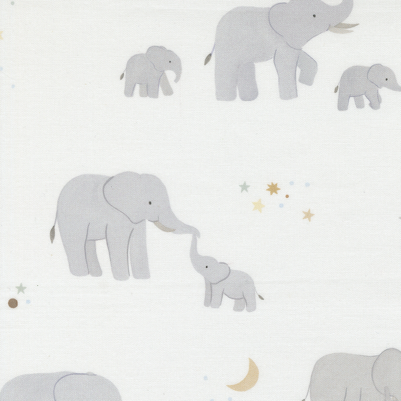 Cream fabric with scenes of mama elephants with their babies on a starry background.