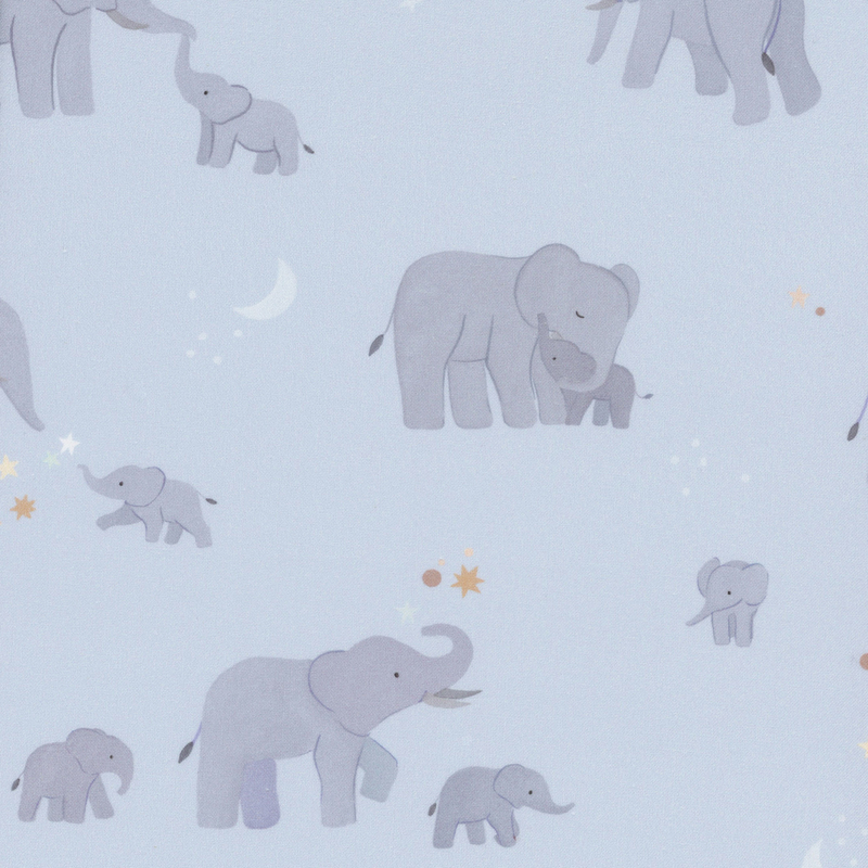 Dusty blue fabric with scenes of mama elephants with their babies on a starry background.