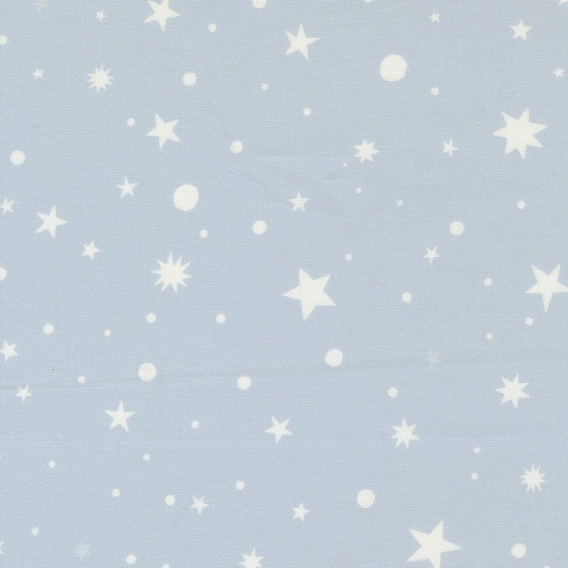 Blue fabric with scattered stars and polka dots.