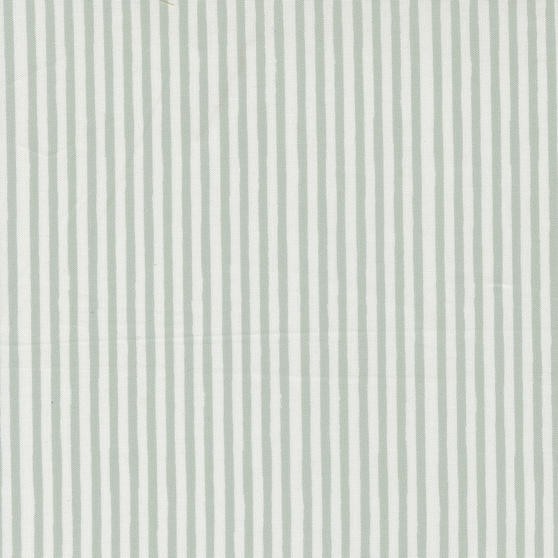 Cream fabric with thin green stripes.