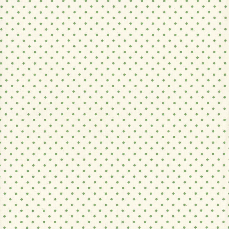 Cream fabric with neat rows of green polka dots.