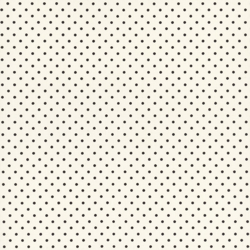 Cream fabric with neat rows of black polka dots.