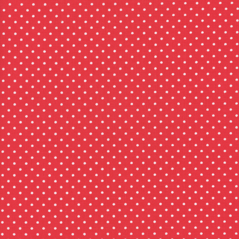 Red fabric with neat rows of white polka dots.