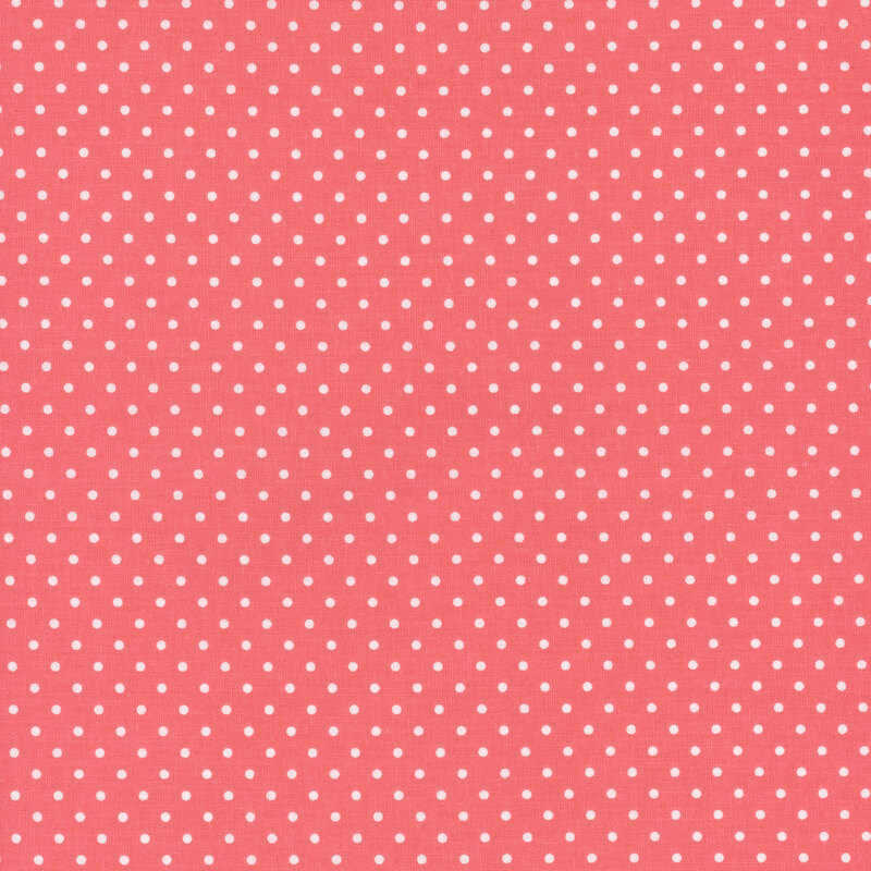 Pink fabric with neat rows of white polka dots.