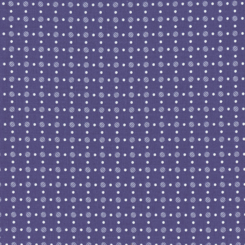 Denim blue fabric with neat rows of polka dots.