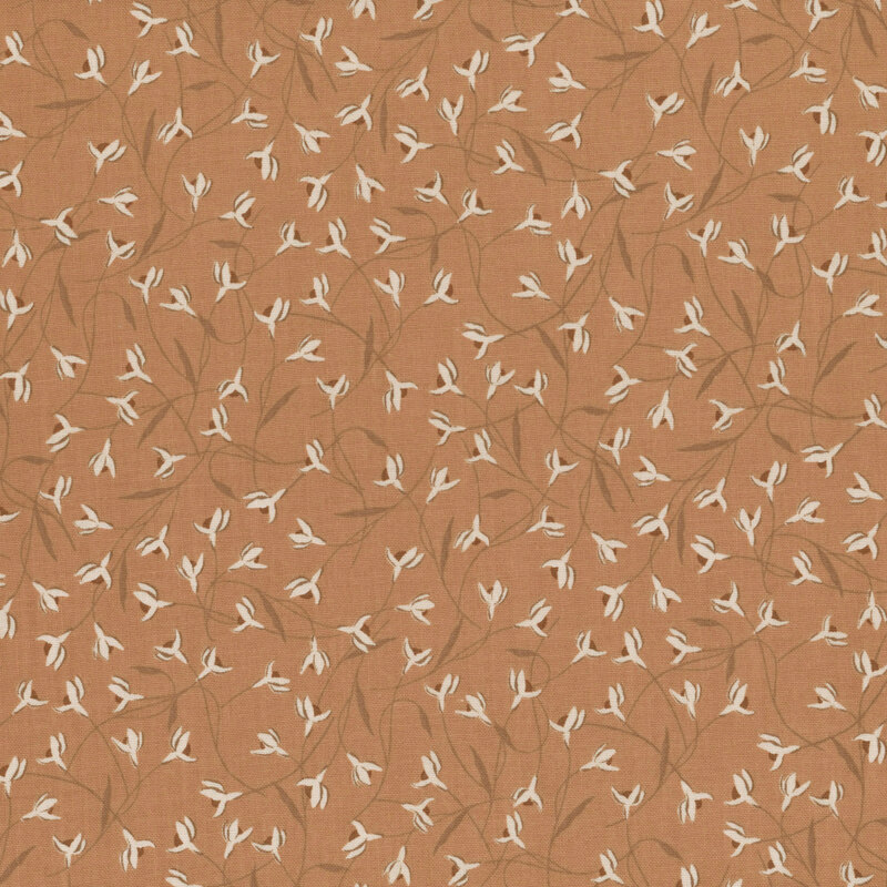 Terra cotta brown fabric with overlapping snowdrop flowers.