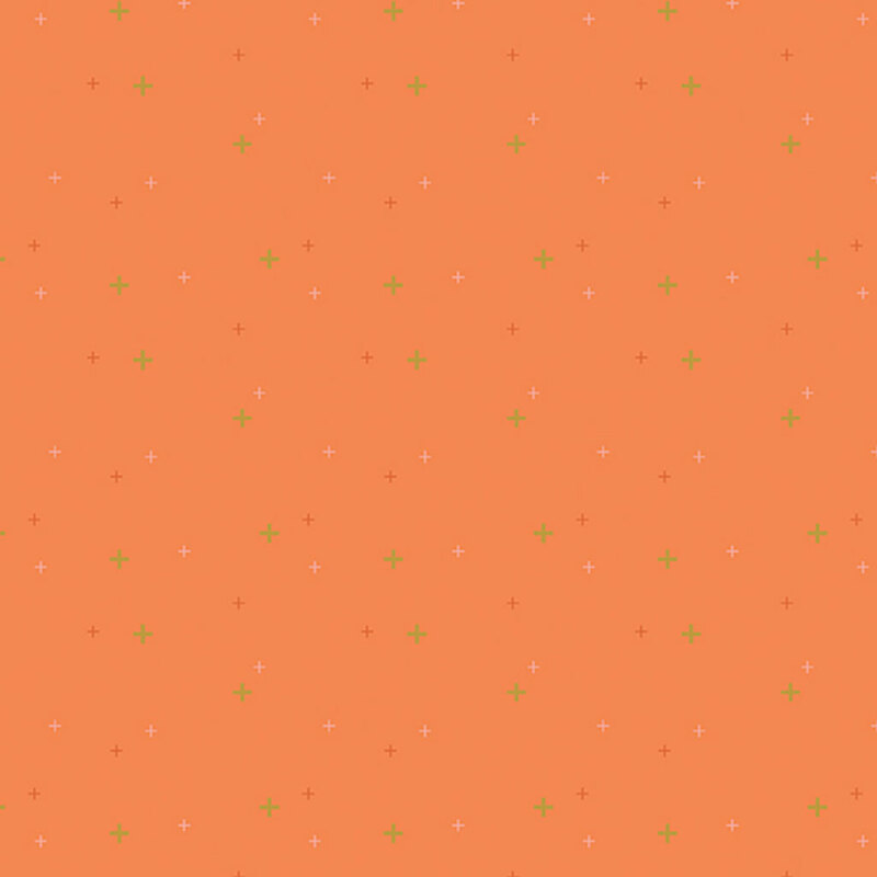 Tangerine orange fabric with multicolored plus signs.