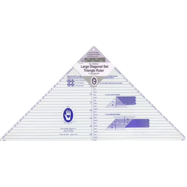 A triangular ruler labeled Large Diagonal Set with measurement markings and a hang tag.