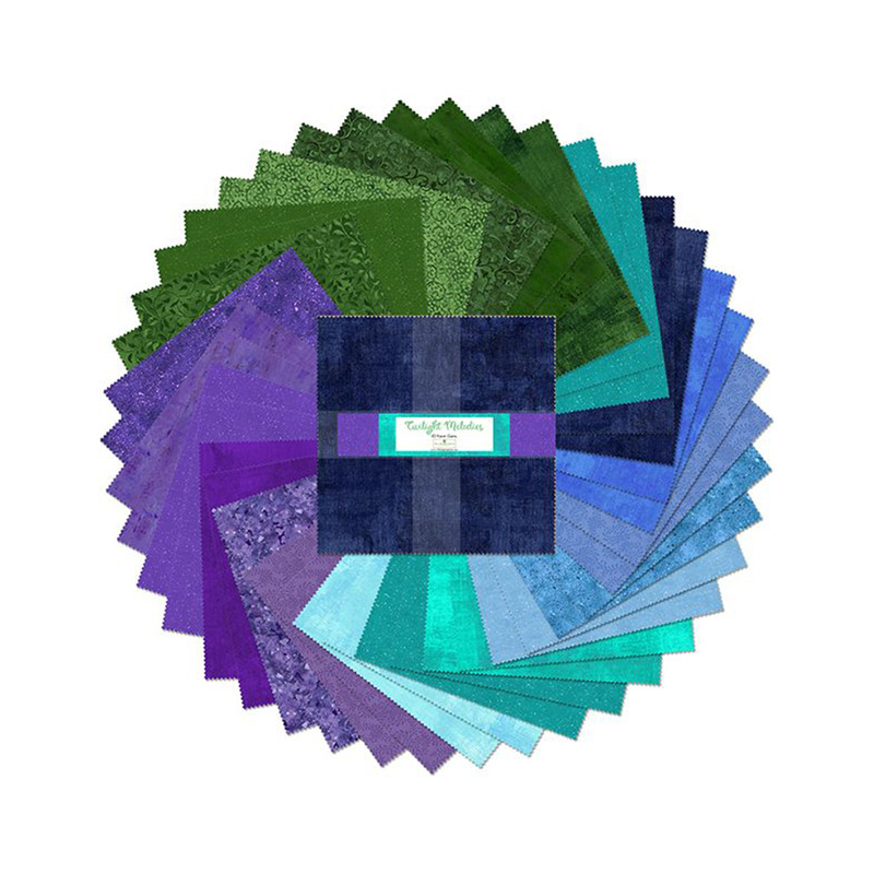 A circular arrangement of blue, purple, and green, and aqua fabric squares 