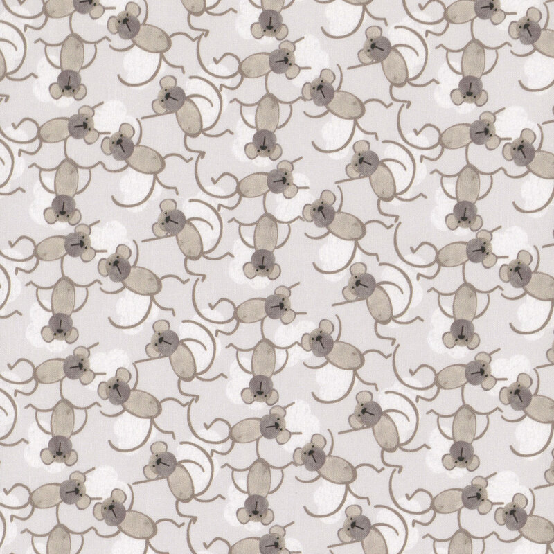 Light gray fabric with a pattern of dancing taupe brown monkeys and off-white clouds