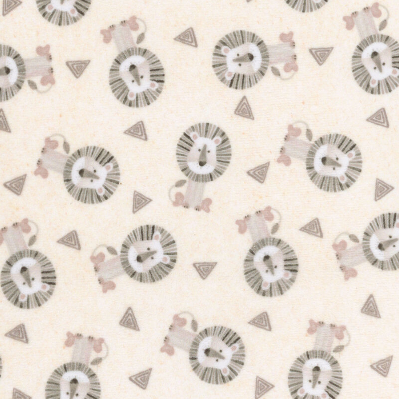 Light beige fabric tossed with lions and geometric shapes