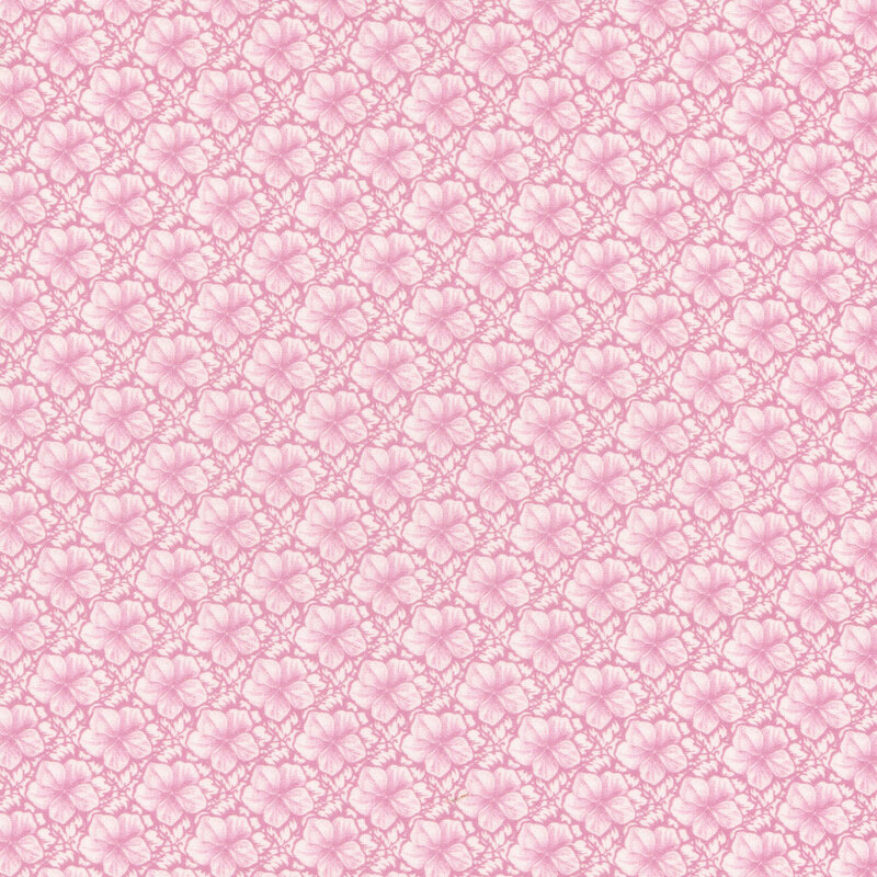 Pink fabric with neat rows of hibiscus flowers.