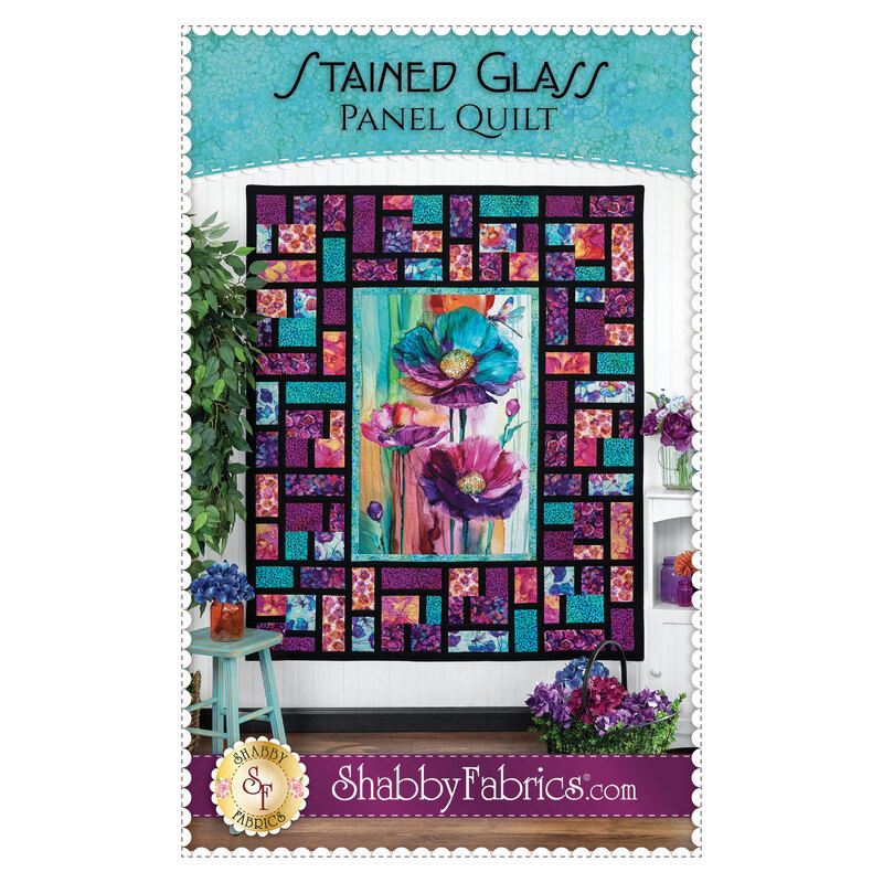 The front cover of the Stained Glass Panel Quilt pattern, showing the completed quilt colored in the Dragonfly Dance collection.