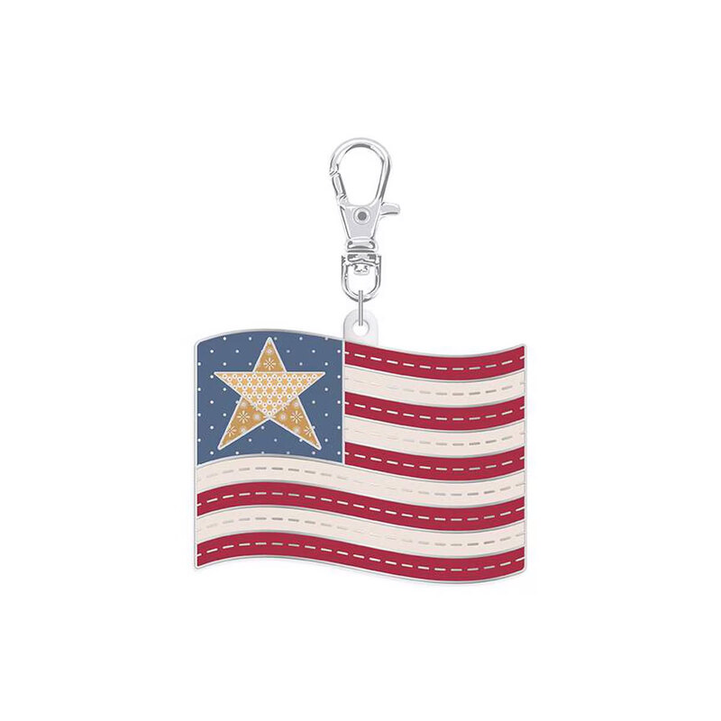 Enamel pin with a metal clip featuring the design of an American flag, isolated on a white background.