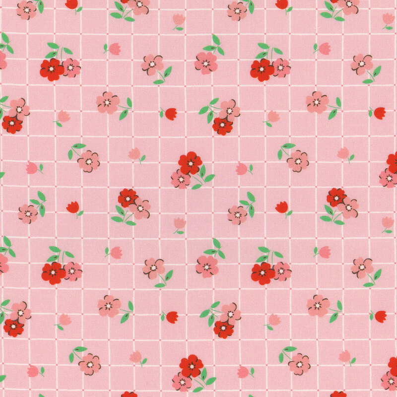 Pink fabric featuring a grid pattern covered in small red and pink florals.