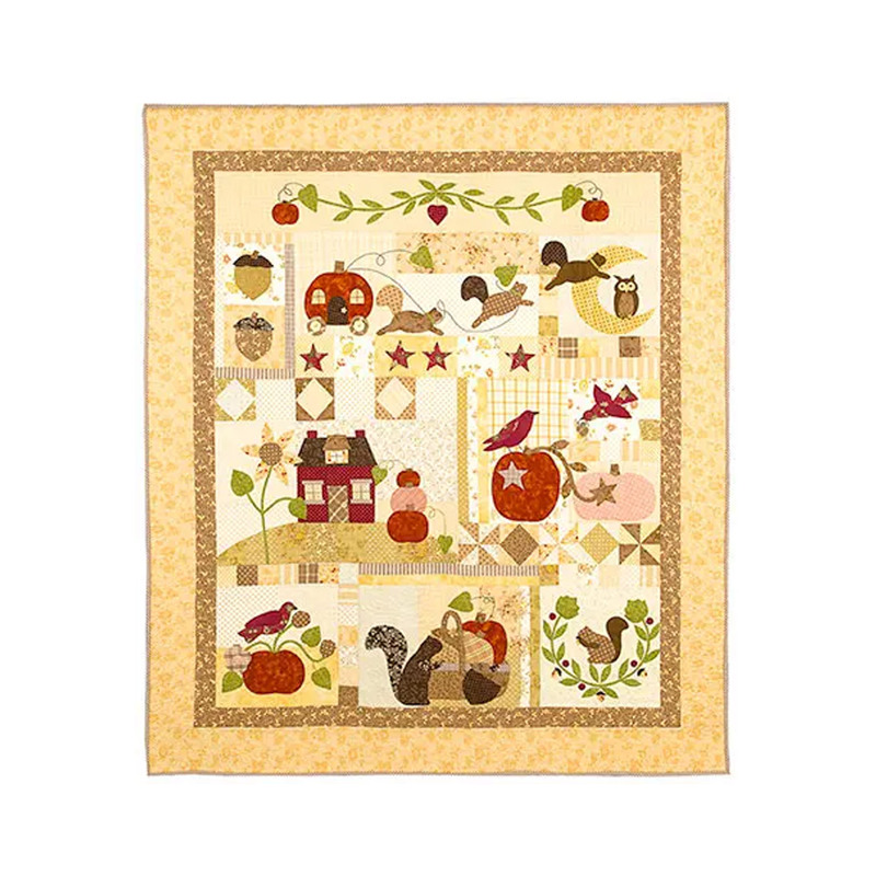 Colorful quilt featuring autumn-themed designs: squirrels, pumpkins, acorns, and birds in patches.