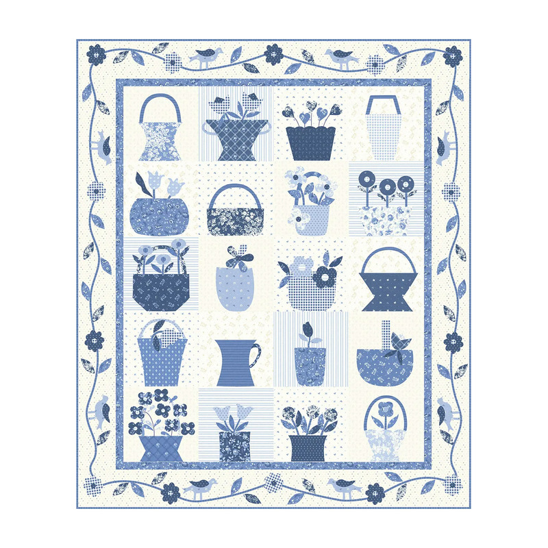 A quilt featuring various blue and white floral baskets and vases arranged in a grid pattern.