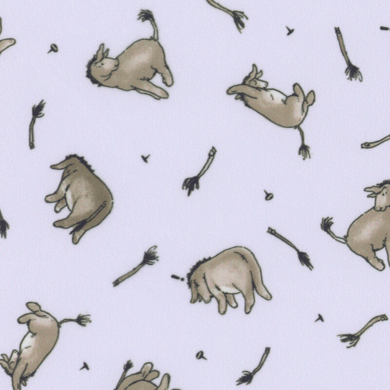 Pastel lilac minky fabric with tossed illustrations of Eeyore the donkey, thumbtacks, and his loose pinned tail.
