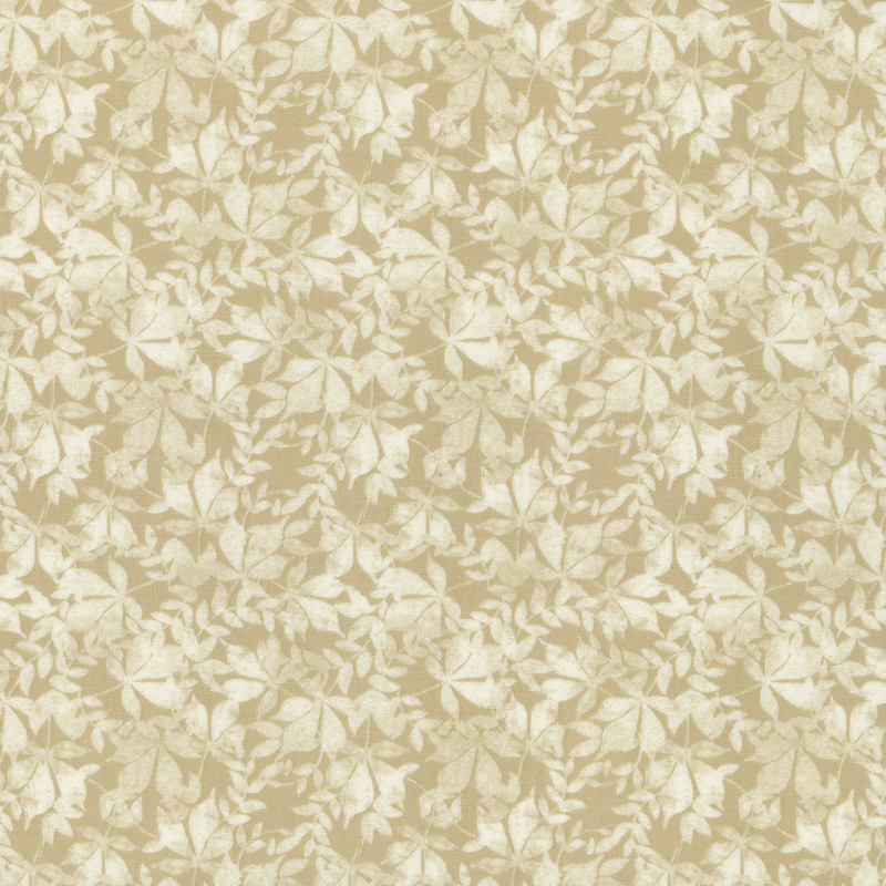 Mottled light leaves on a beige fabric.