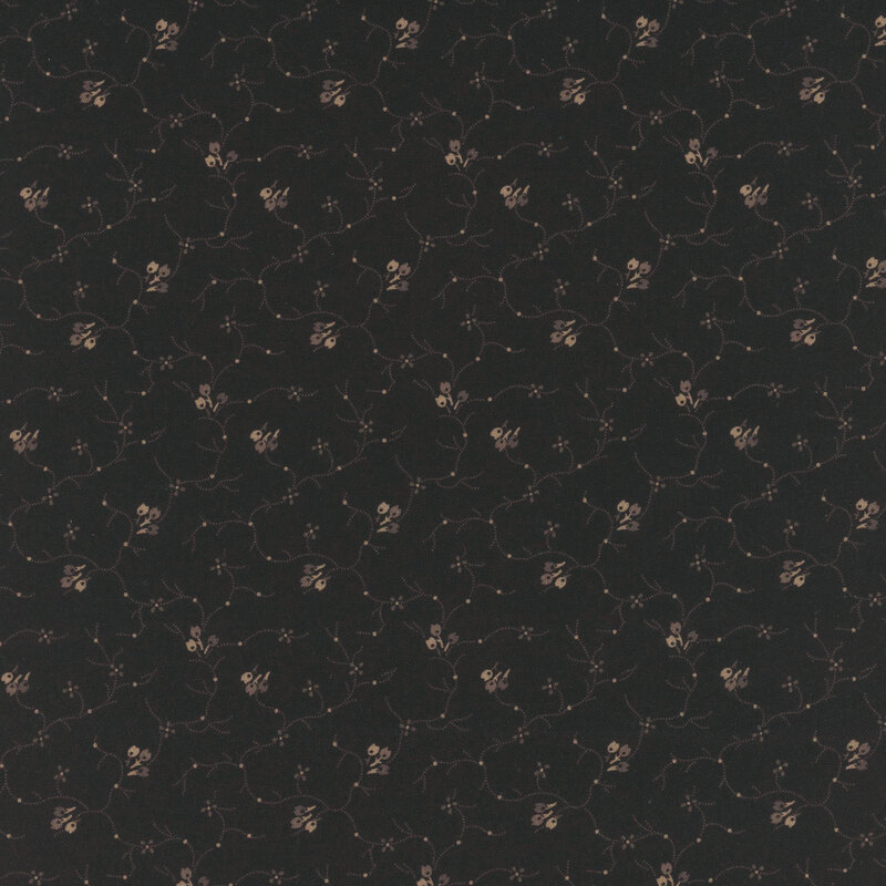 Black fabric with sprawling leaves and abstract floral designs.