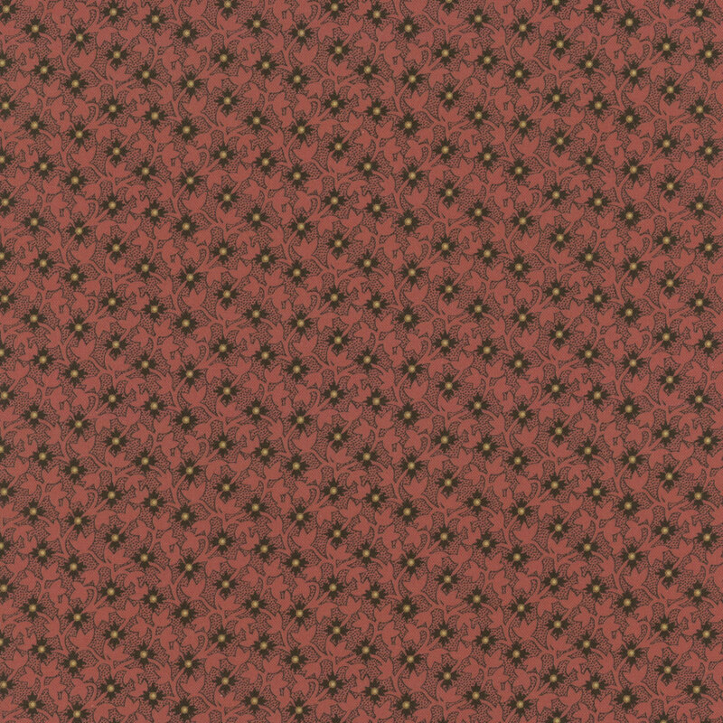 Orange fabric with diagonal rows of black flowers on a tonal leafy background.