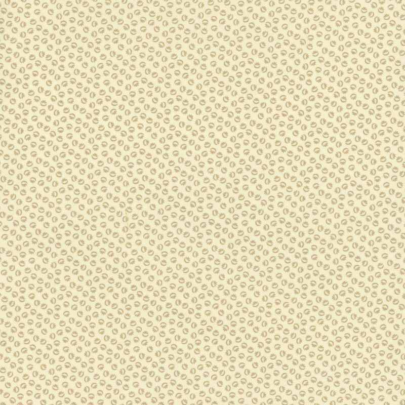 Cream fabric with a tonal design of abstract ditsy shapes.
