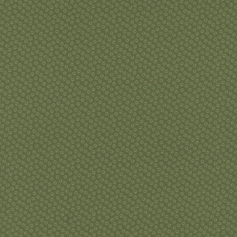 Green fabric with a tonal design of abstract ditsy shapes.