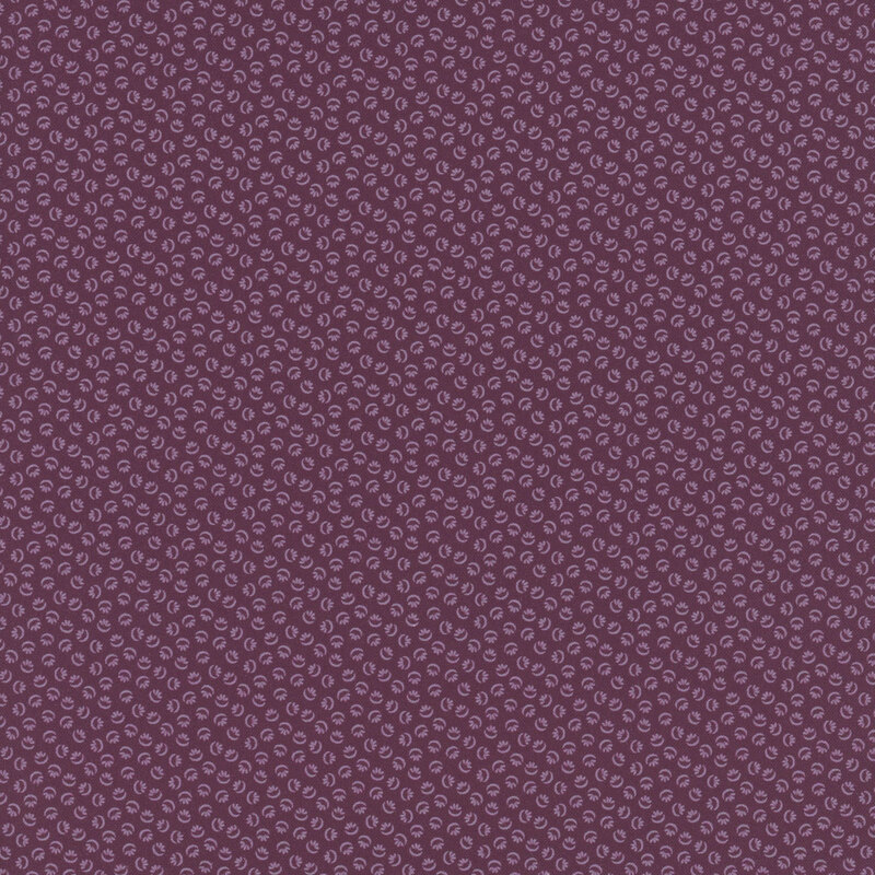 Purple fabric with a tonal design of abstract ditsy shapes.